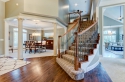 The geometric-patterned stair carpet, previously recommended dining room table and the new dining room overhead light make modern first-impression to visitors.
