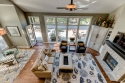 See how light and dark play together? We darkened the mantle on the right side to add contrast to the stone fireplace and lighter furnishings while matching the darker furnishings. 