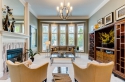 This space centers on the furniture I previously recommended. The new chandelier, tile mosaic around the fireplace, framed art, and accessories bring elegance & comfort.