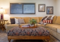 The ottoman contrasts with the lighter sectional and offers a noticeable pop of a pattern to this part of the room. 