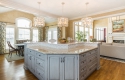 A terrific look at the updated island. You can also see how the island color palette coordinates with the lightness of the kitchen table area in the background.