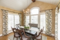 Lots to see here: new table and chairs (with neutral grey seats), area rug, hanging light, and draperies. Even with patterns, we stayed neutral/cool with color palette.