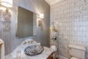 The powder bath off the kitchen was previously very dark, with a red floral wallpaper. Like the living room and kitchen, the goal was to lighten the space.