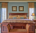 We also added new bedding to complement the existing furniture and color updates. Note the two-tone style of the draperies; the ends are closer to the wall color, while the inside is lighter.