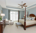We kept the client's existing furniture with its rich brown color, and then painted the walls a soft, cool, blue/grey. This color connects to the cool colors in the bathroom wall treatment.