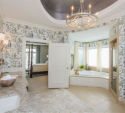 The dark ceiling metallic faux finish also draws the eye to the gorgeous new chandelier.