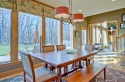 We added the new lighting over the table, and framed the large windows with the fabric added to the valance.