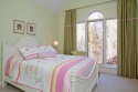 In the first of two children's rooms, we chose wall and draperies colors to play off the bedding the client chose. The draperies do fully close over the large window.