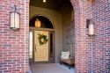 Starting from the outside in, we added a new paint color on the door and new eye catching lighting.