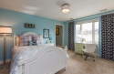 This room was designed for a "tween" who loved art. The new wall color is great for showcasing her own work, and the draperies, ceiling, light and refinished desk complete this space fit for a young artist.